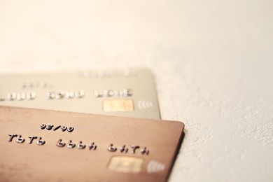 Photo of Two credit cards on gray background, closeup. Space for text