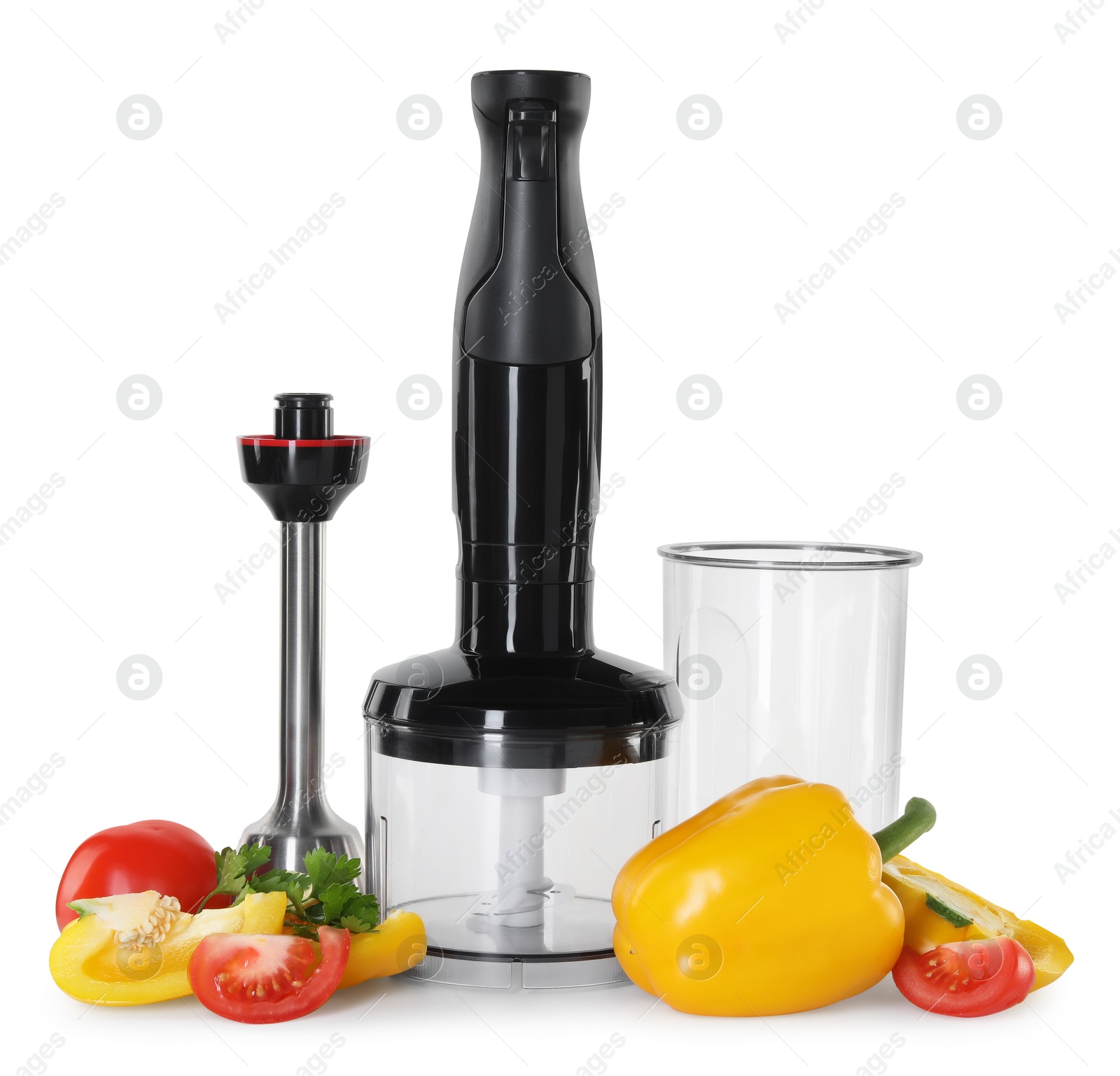 Photo of Hand blender kit and fresh vegetables isolated on white