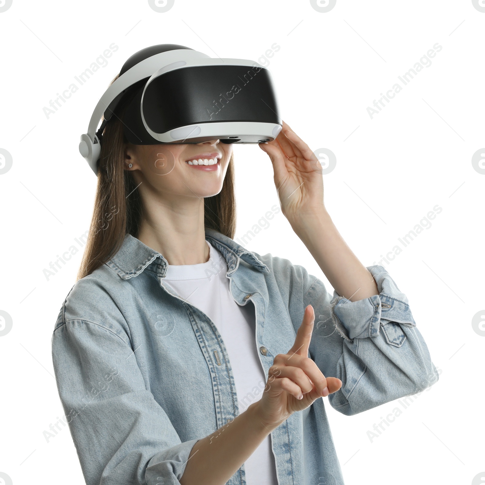 Photo of Smiling woman using virtual reality headset on white background