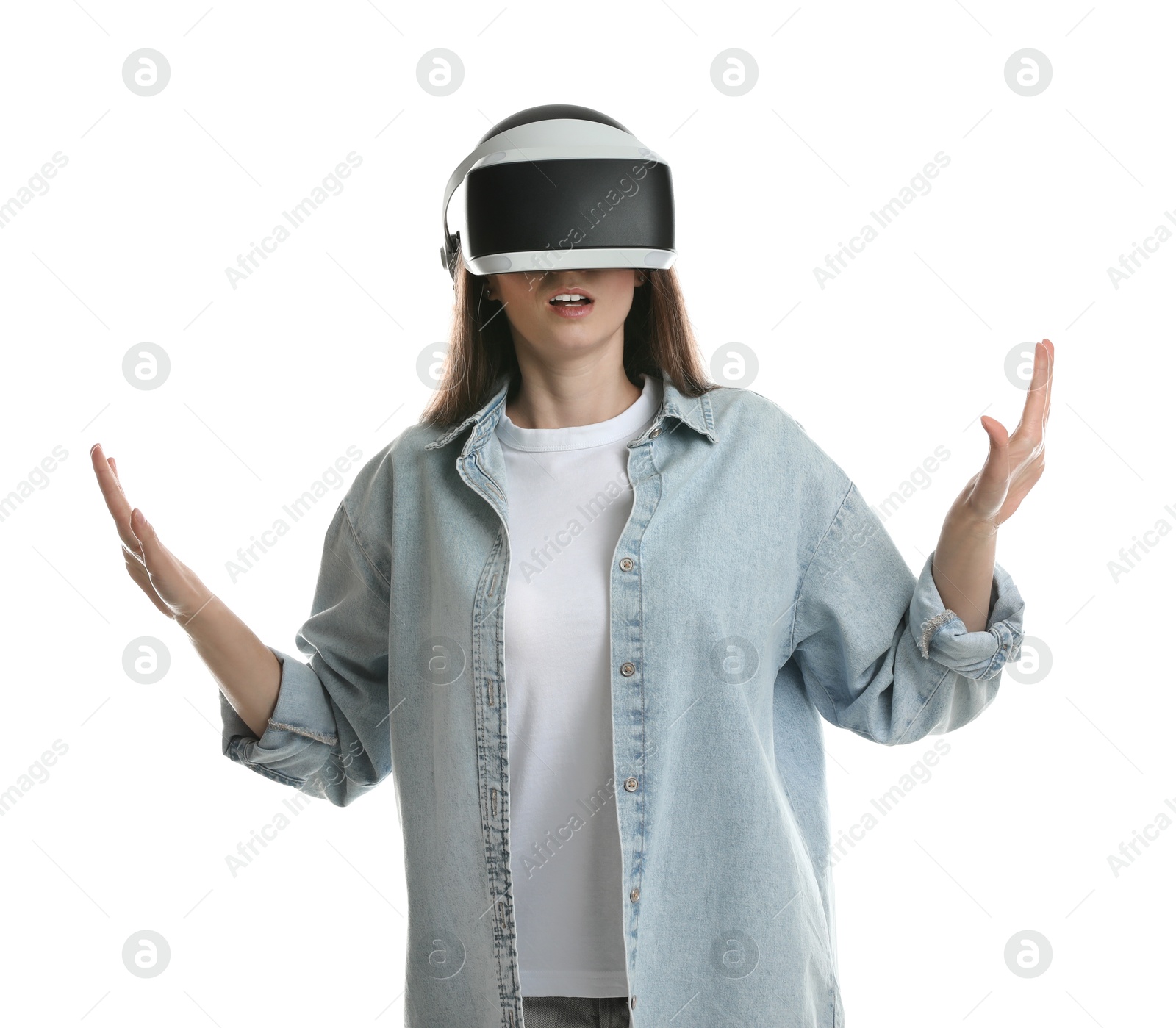 Photo of Surprised woman using virtual reality headset on white background