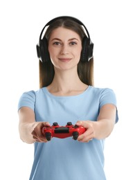 Beautiful woman in headphones with controller on white background