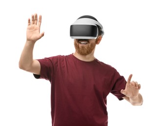 Smiling man using virtual reality headset on white background