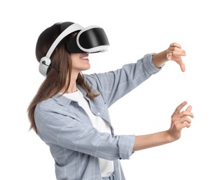 Smiling woman using virtual reality headset on white background