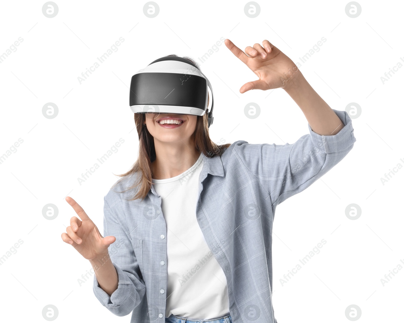 Photo of Smiling woman using virtual reality headset on white background