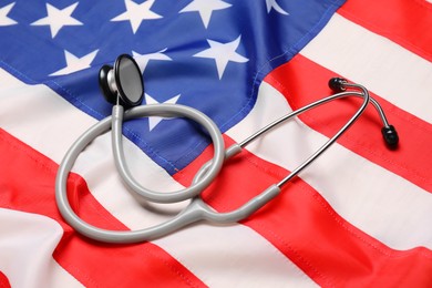 Stethoscope on USA flag, closeup. Health care concept