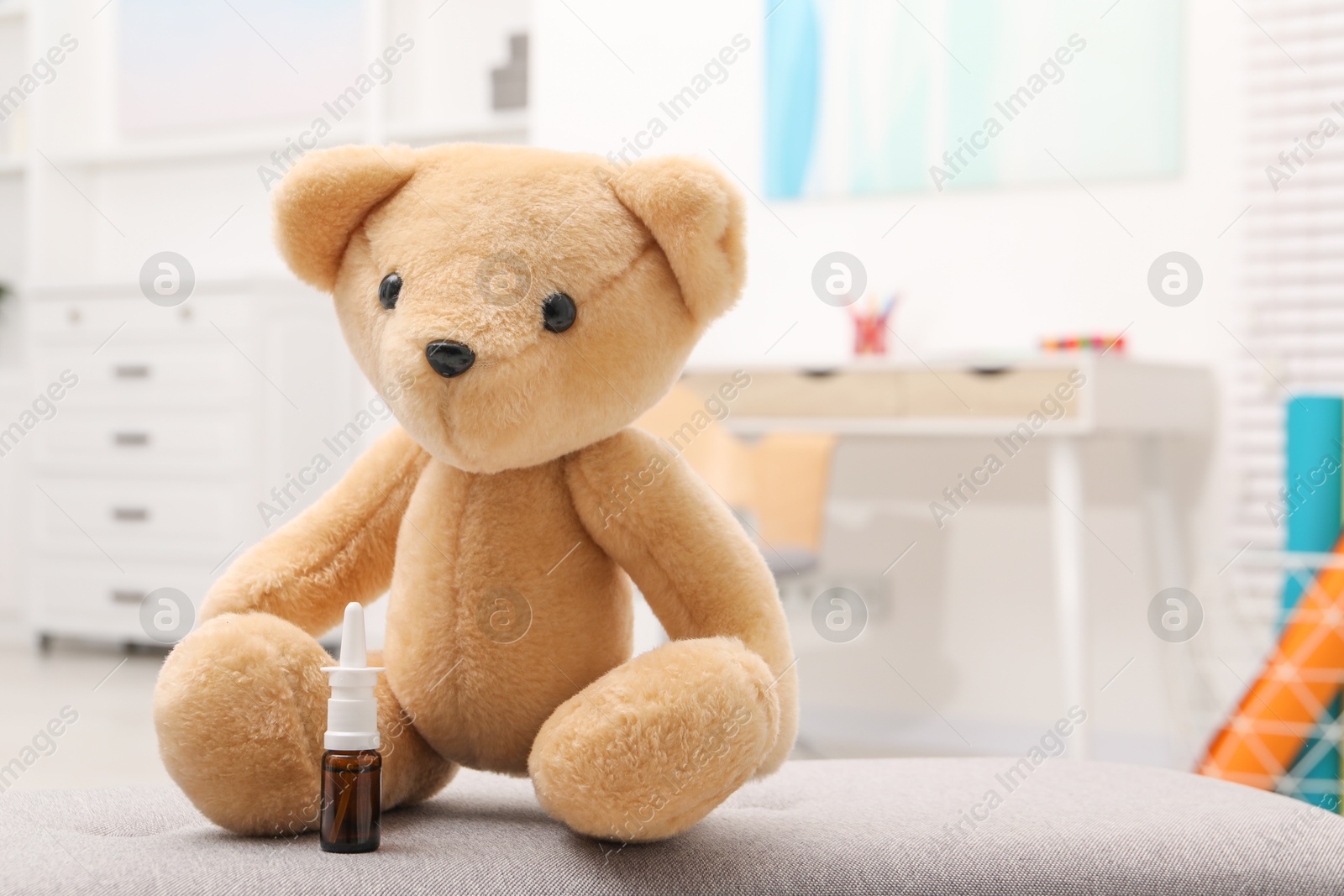 Photo of Toy cute bear with nasal spray indoors, space for text