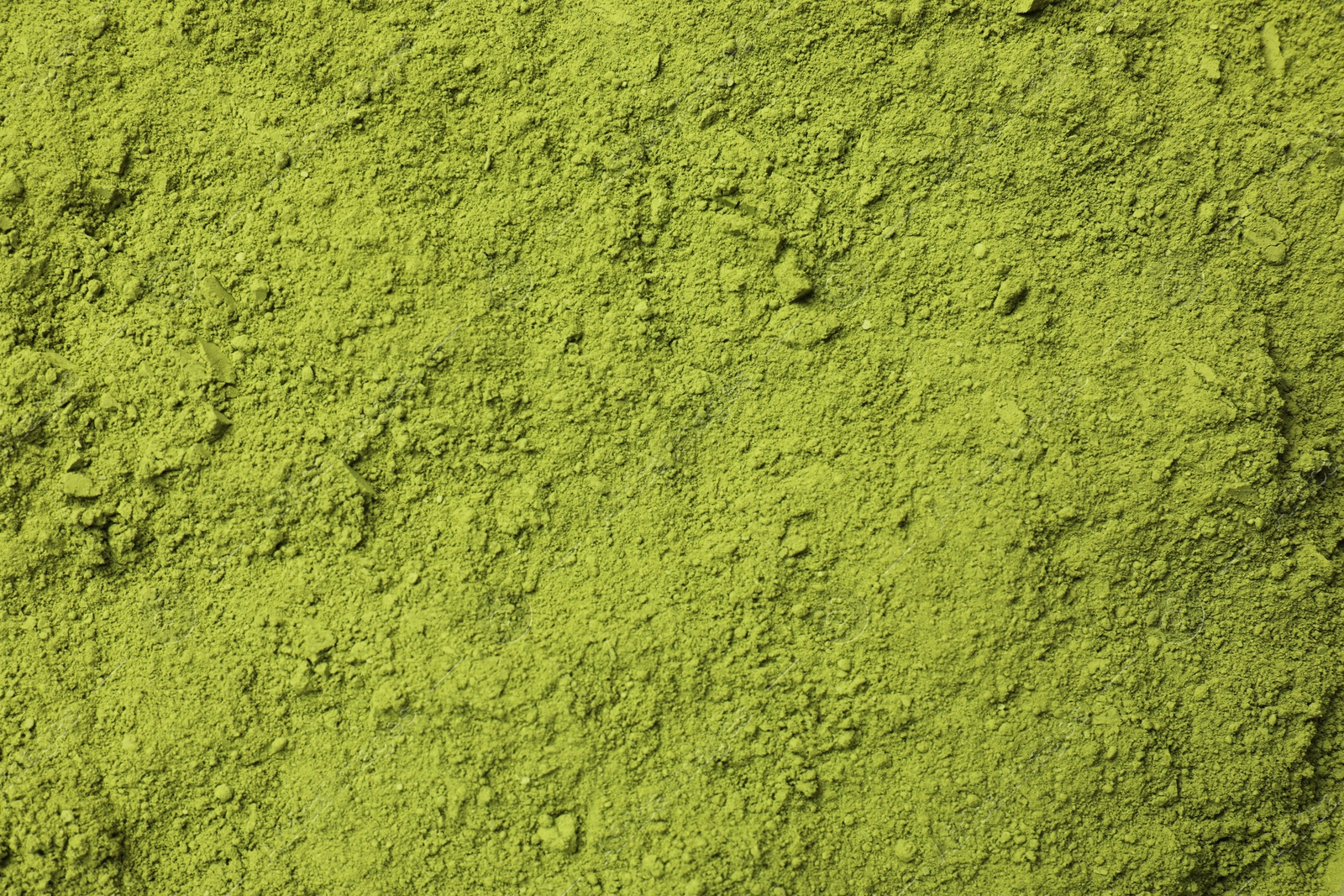 Photo of Green matcha powder as background, top view