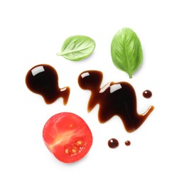 Delicious balsamic vinegar, cut tomato and basil isolated on white, top view