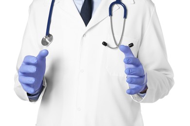Photo of Doctor in gloves holding something on white background, closeup