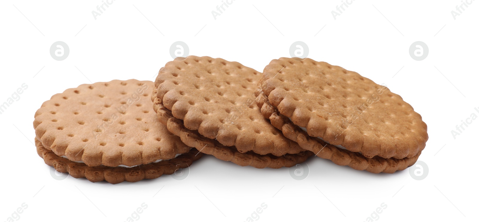 Photo of Three tasty sandwich cookies isolated on white