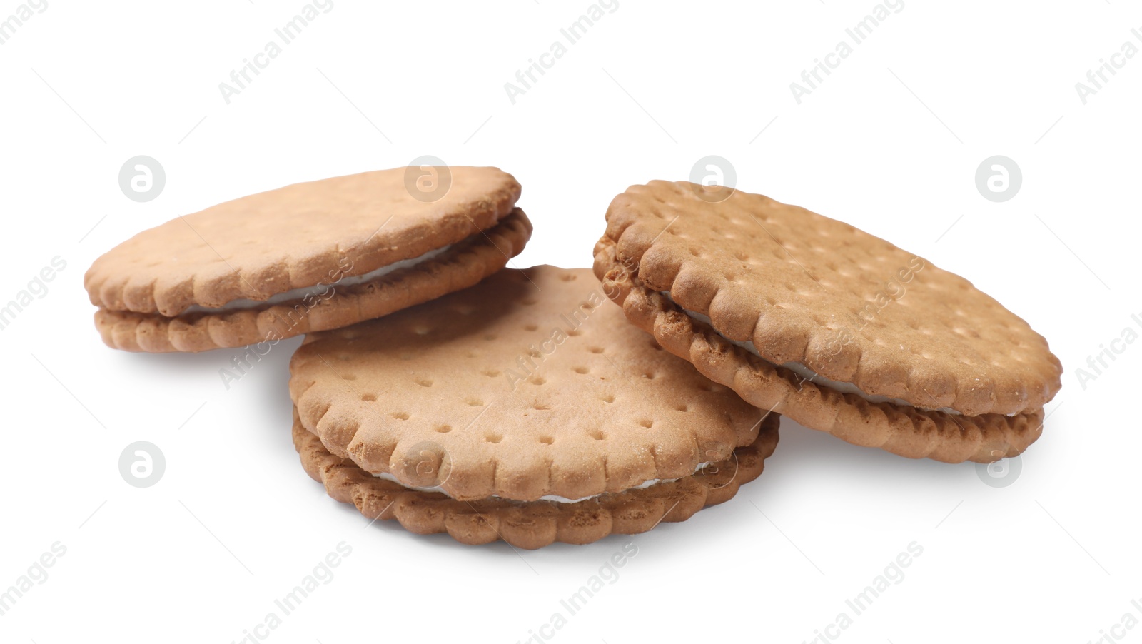 Photo of Three tasty sandwich cookies isolated on white