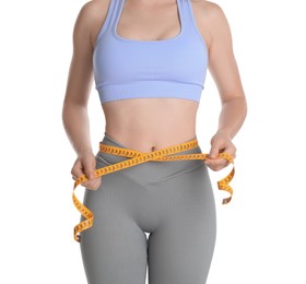 Woman with measuring tape showing her slim body against white background, closeup