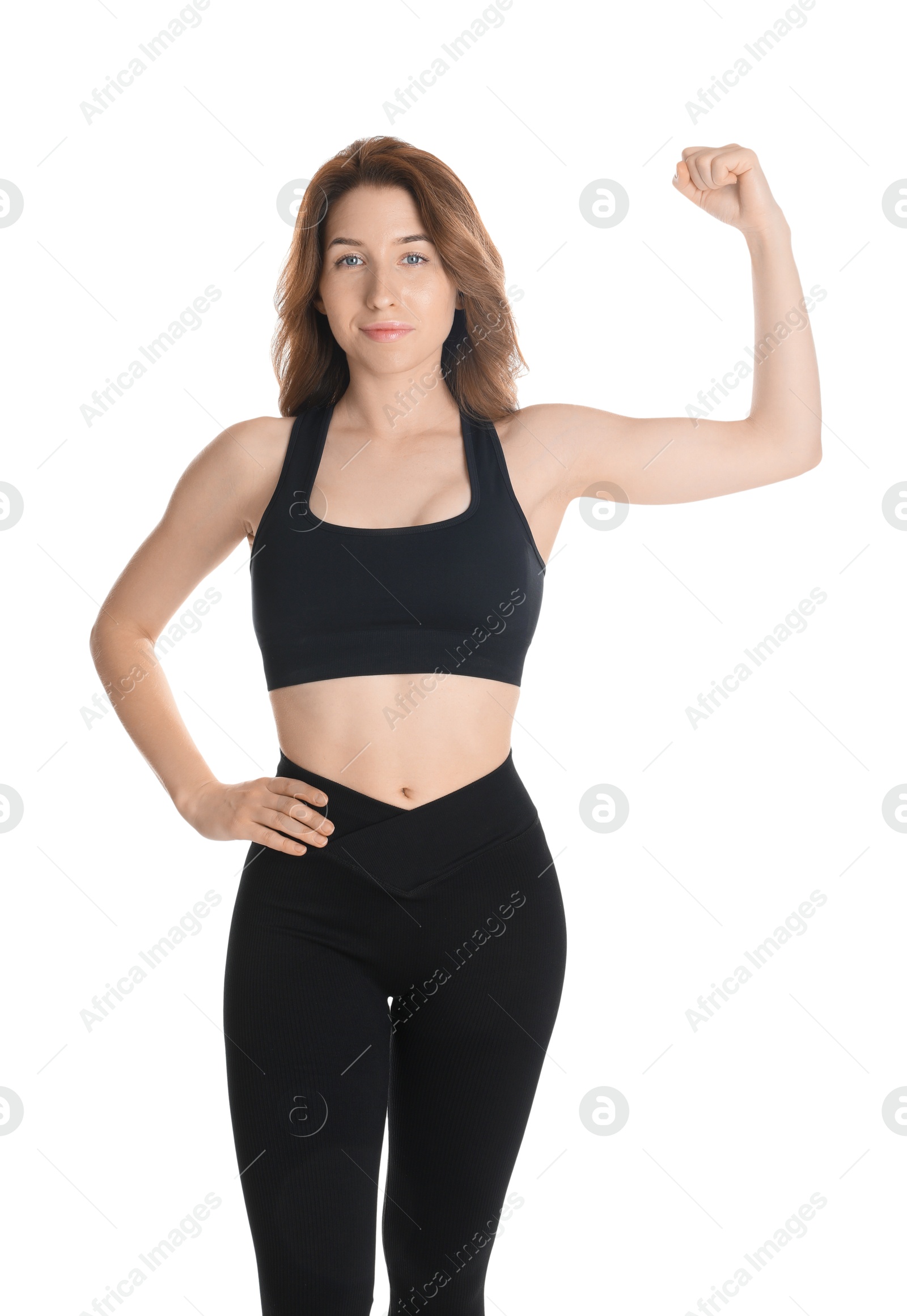 Photo of Woman with slim body showing muscles on white background