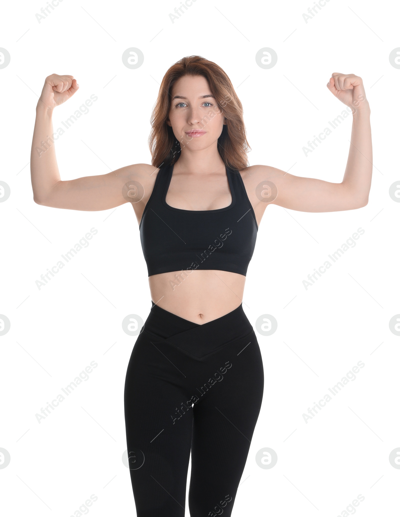 Photo of Woman with slim body showing muscles on white background