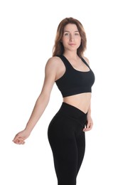 Woman with slim body posing on white background