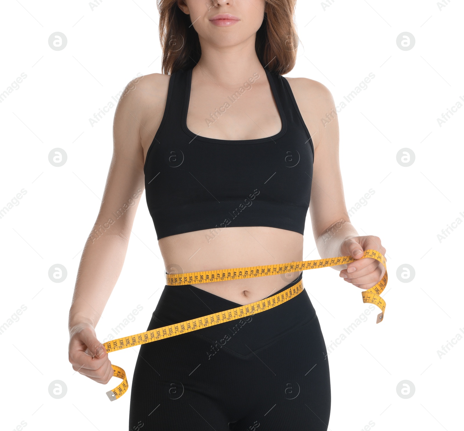 Photo of Woman with measuring tape showing her slim body against white background, closeup