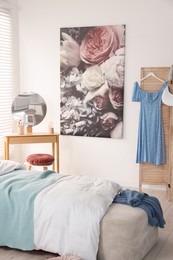 Teen's room interior with modern furniture and beautiful picture on wall