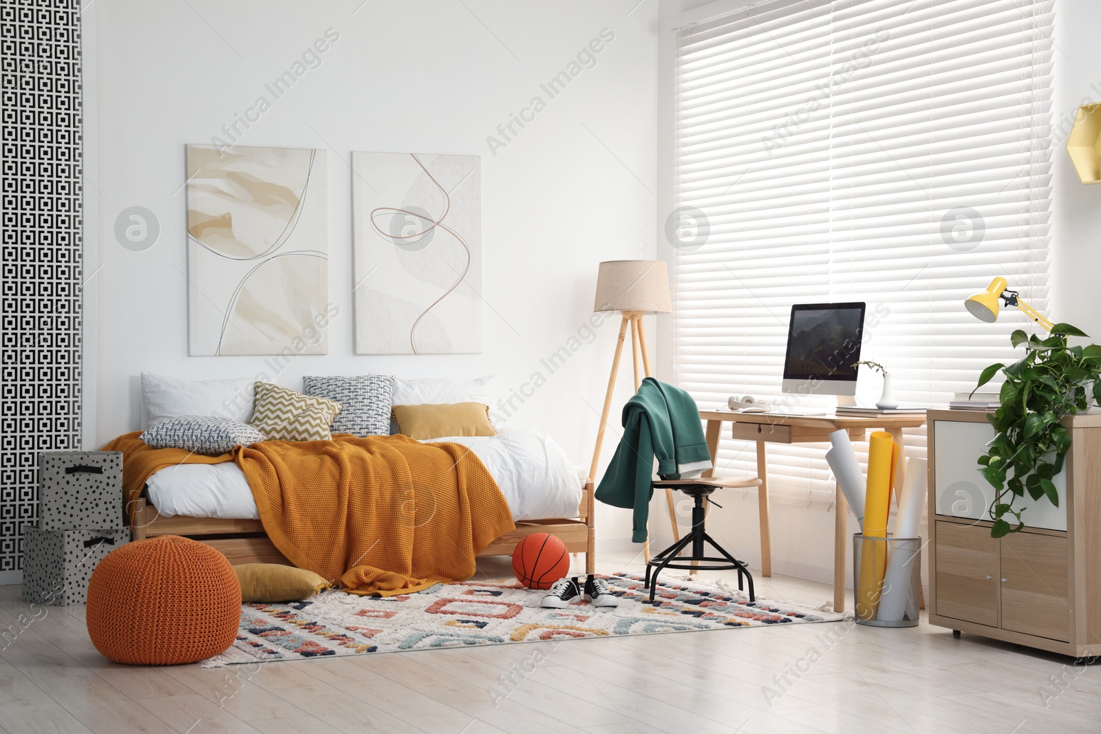 Photo of Teen's room interior with modern furniture and beautiful pictures on wall