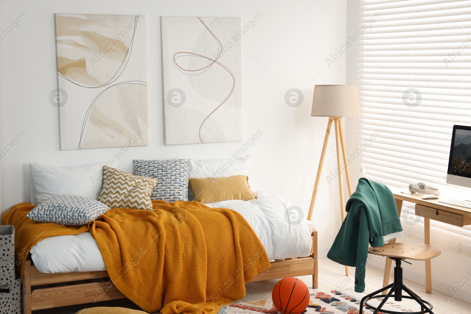 Photo of Teen's room interior with modern furniture and beautiful pictures on wall