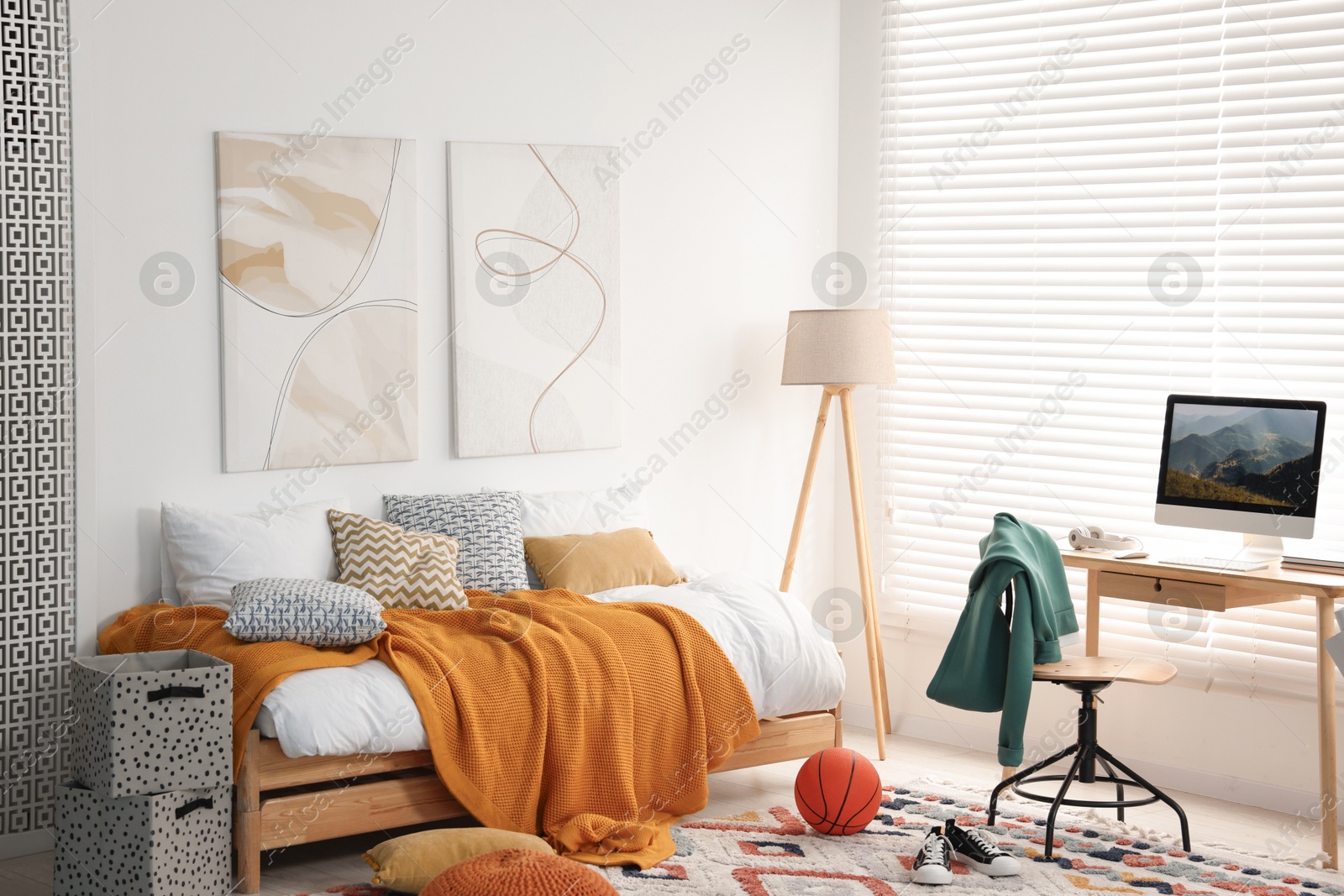 Photo of Teen's room interior with modern furniture and beautiful pictures on wall