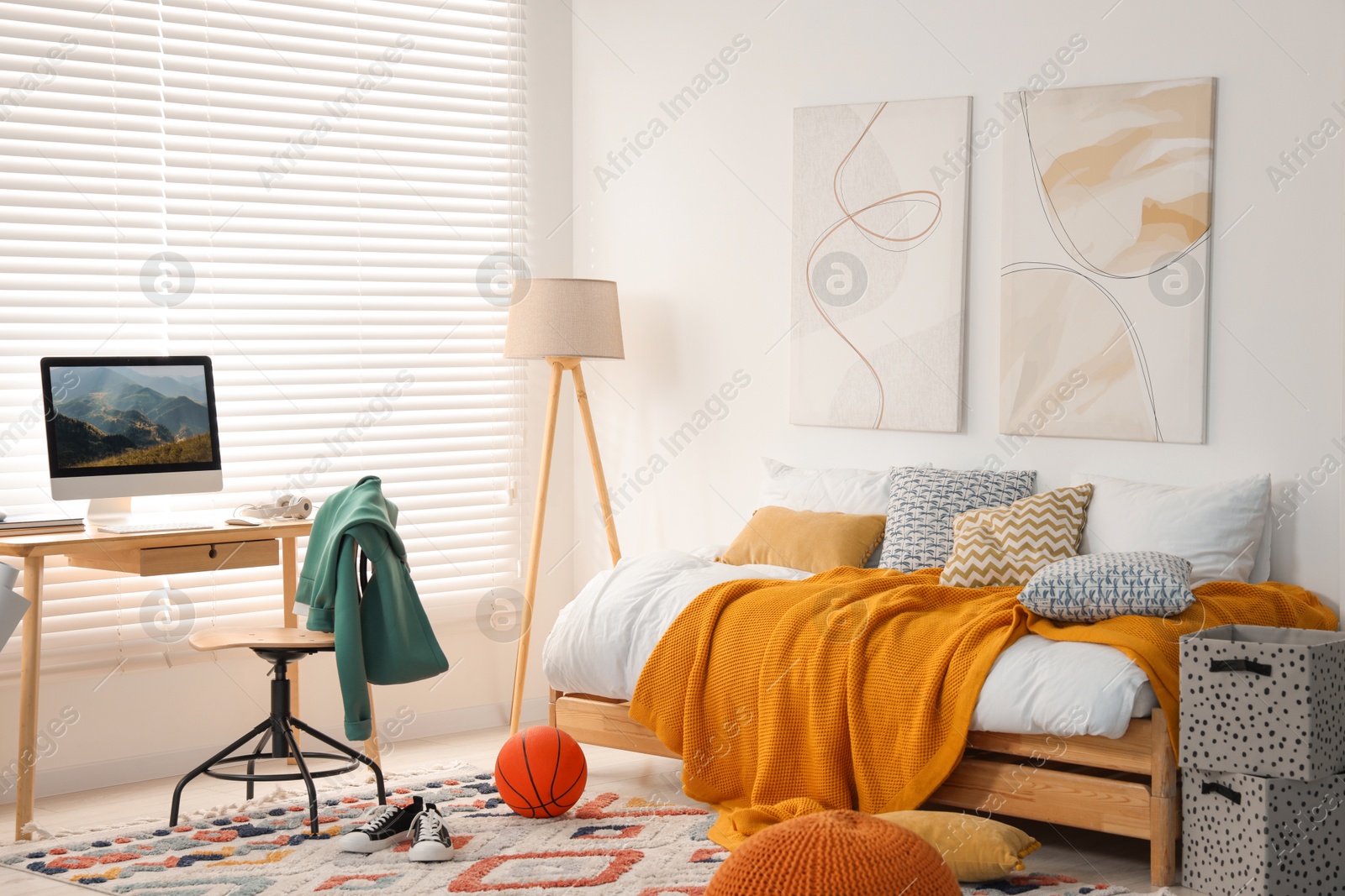 Photo of Teen's room interior with modern furniture and beautiful pictures on wall