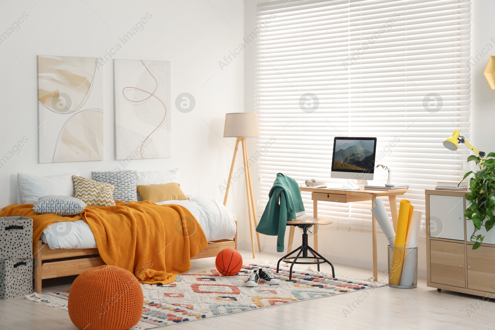 Photo of Teen's room interior with modern furniture and beautiful pictures on wall