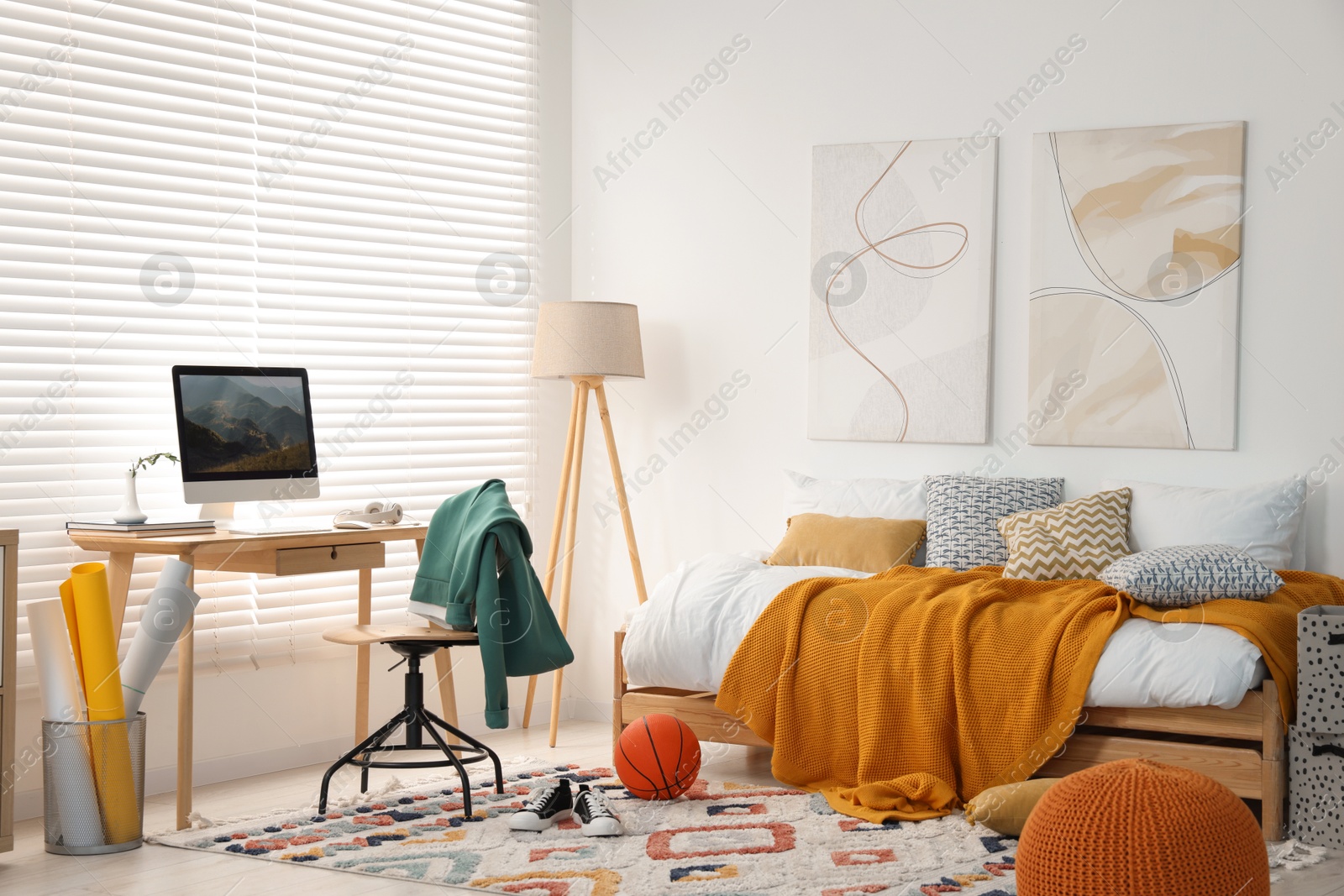 Photo of Teen's room interior with modern furniture and beautiful pictures on wall