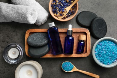 Flat lay composition with spa products on gray table