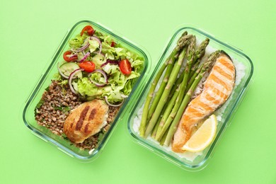 Photo of Healthy food. Different meals in glass containers on green background, top view