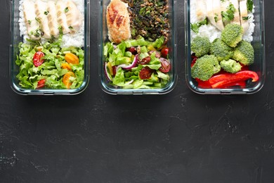 Photo of Healthy food. Different meals in glass containers on black table, flat lay. Space for text