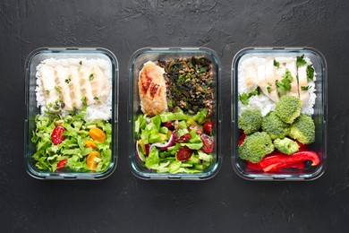 Photo of Healthy food. Different meals in glass containers on black table, flat lay