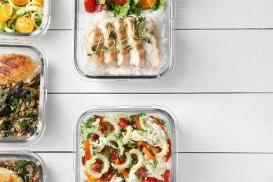 Photo of Healthy meal. Containers with different products on white wooden table, flat lay. Space for text