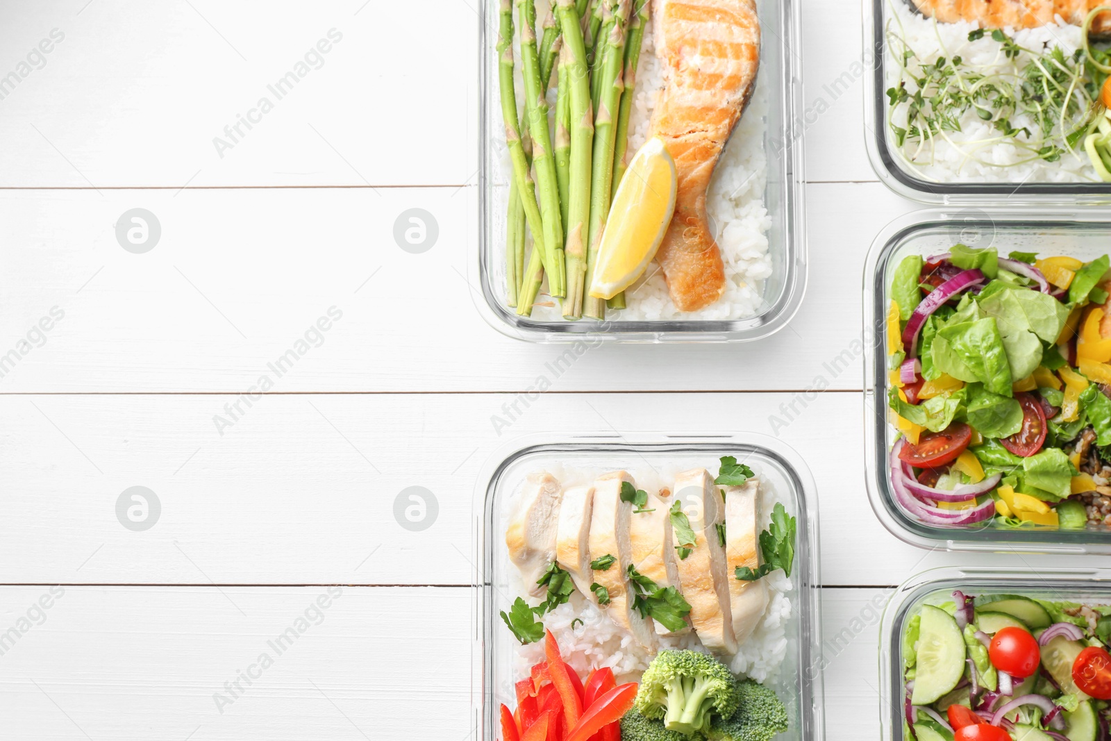 Photo of Healthy meal. Containers with different products on white wooden table, flat lay. Space for text