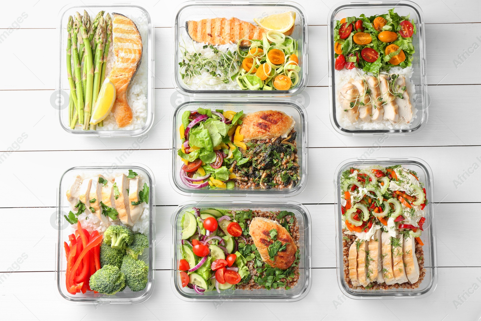 Photo of Healthy meal. Containers with different products on white wooden table, flat lay