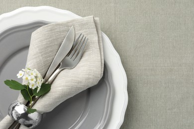 Photo of Stylish setting with cutlery and plates on table, top view. Space for text