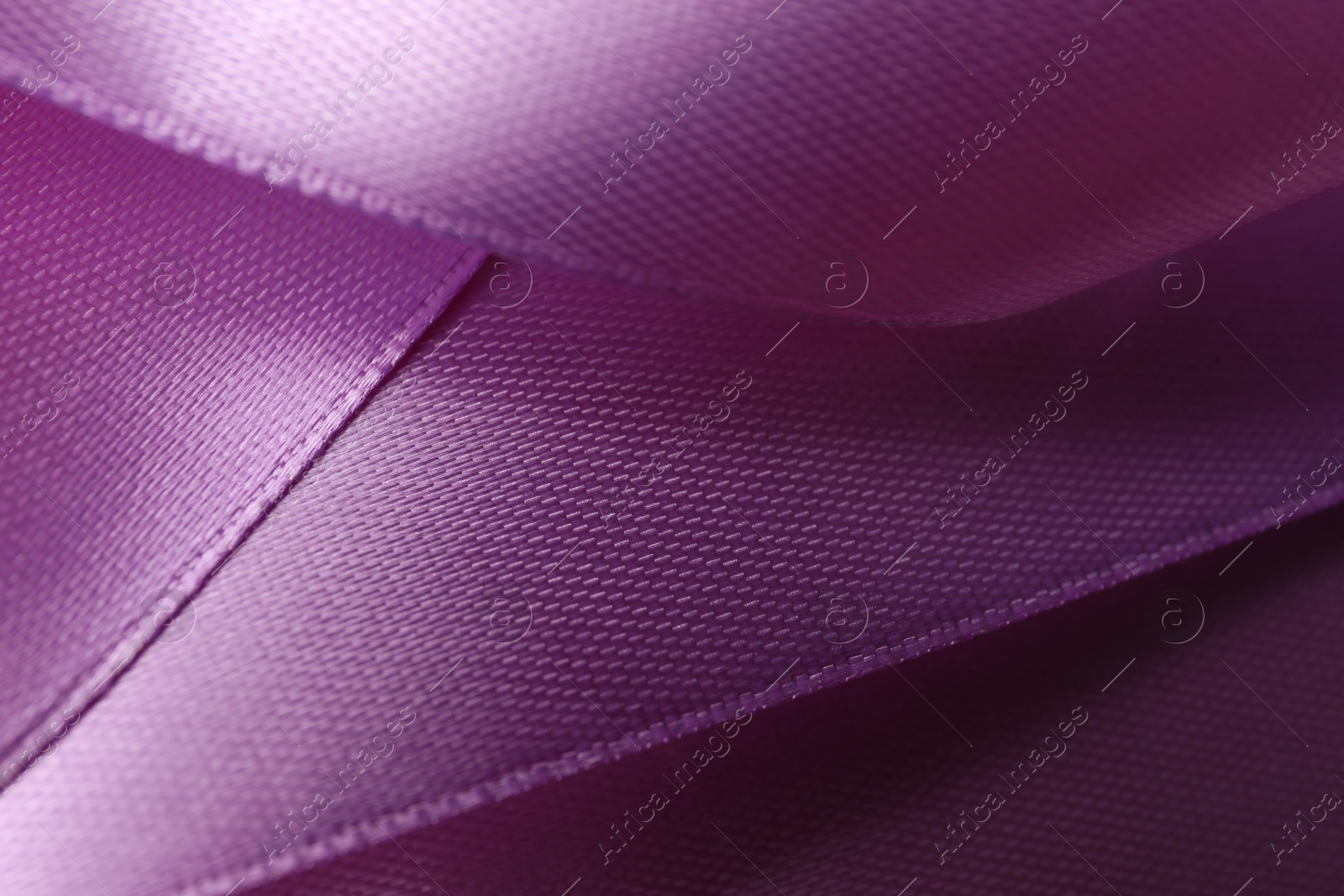 Photo of Beautiful purple ribbon as background, closeup view