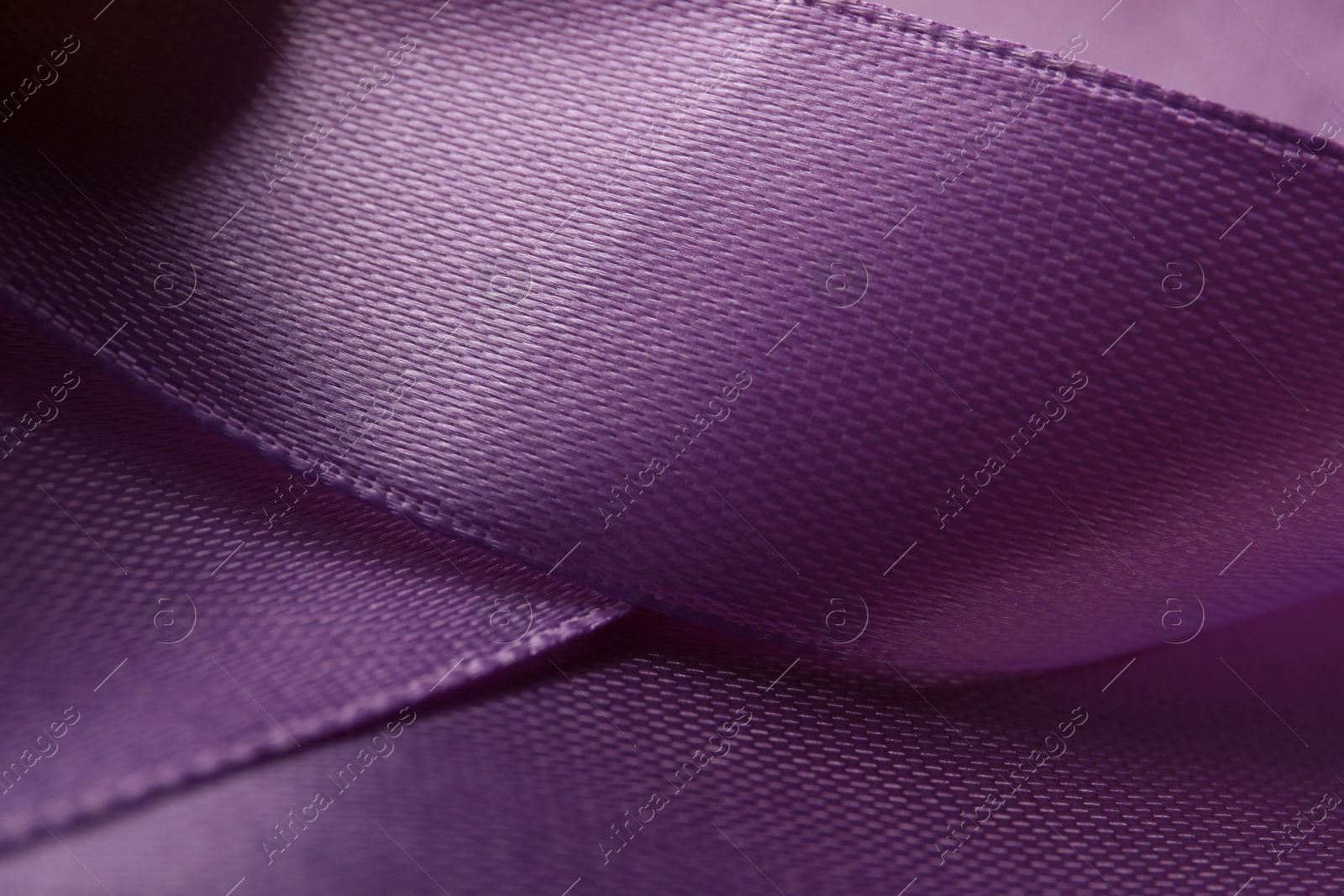 Photo of Beautiful purple ribbon as background, closeup view