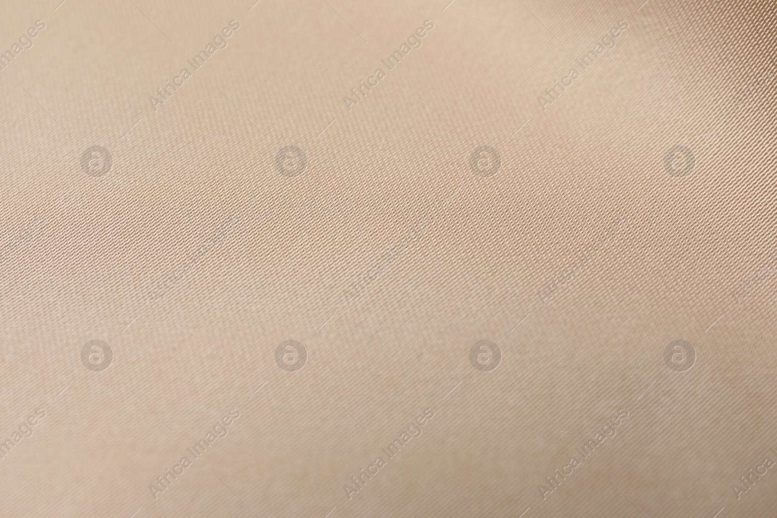 Photo of Beautiful beige ribbon as background, closeup view