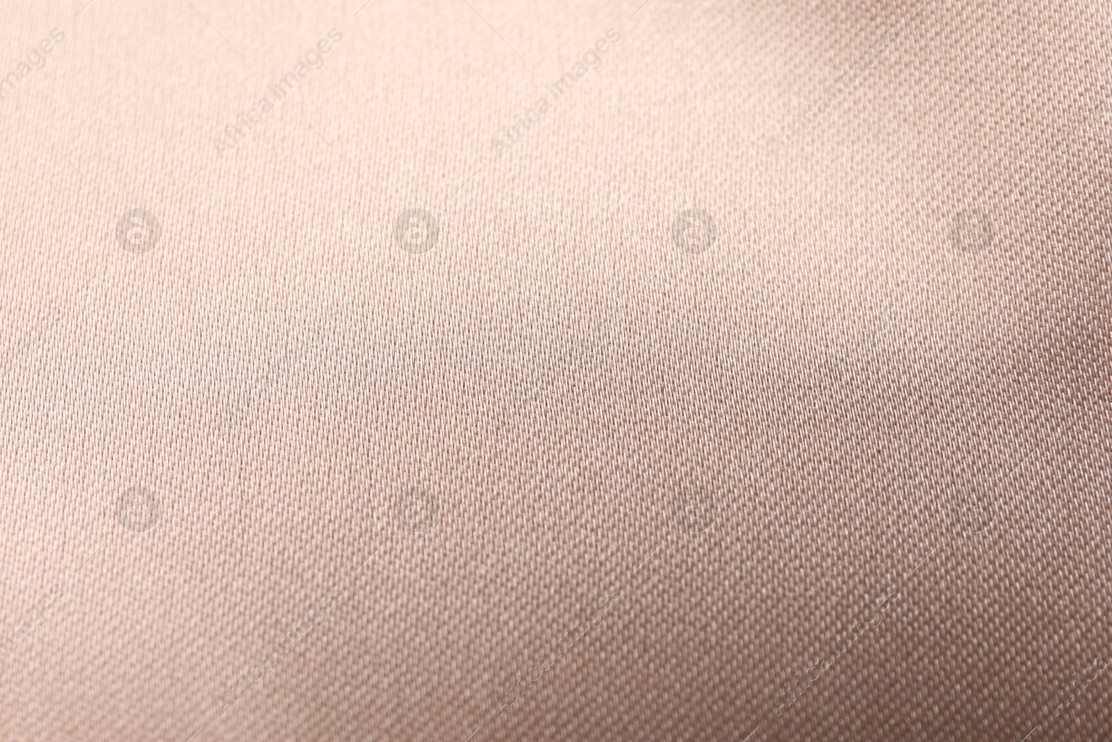 Photo of Beautiful beige ribbon as background, closeup view