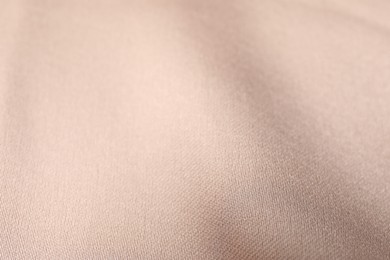 Beautiful beige ribbon as background, closeup view