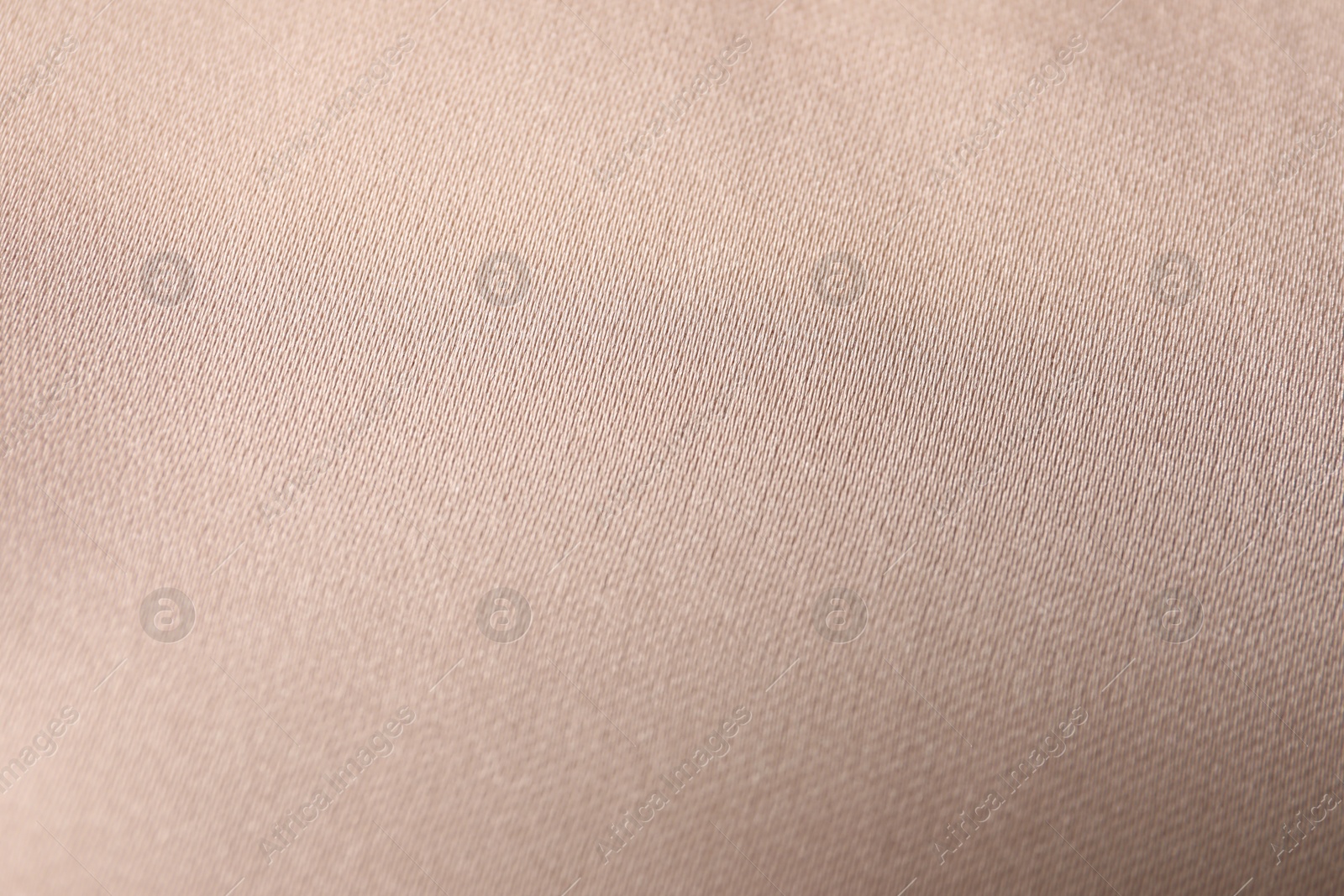 Photo of Beautiful beige ribbon as background, closeup view