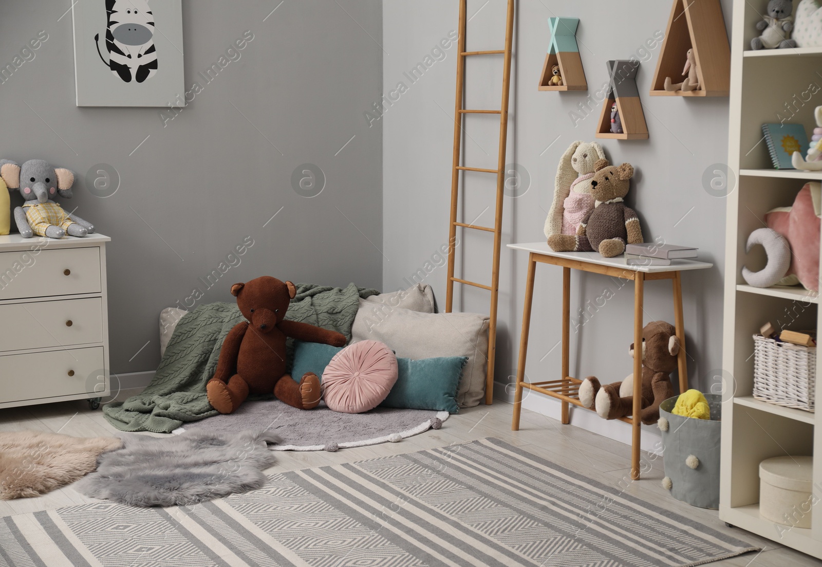 Photo of Stylish child room interior with modern furniture and toys