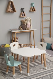 Photo of Stylish child room interior with modern furniture and toys