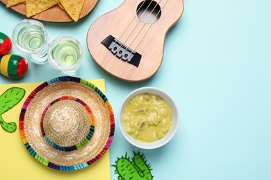 Photo of Flat lay composition with Mexican sombrero hat on color background