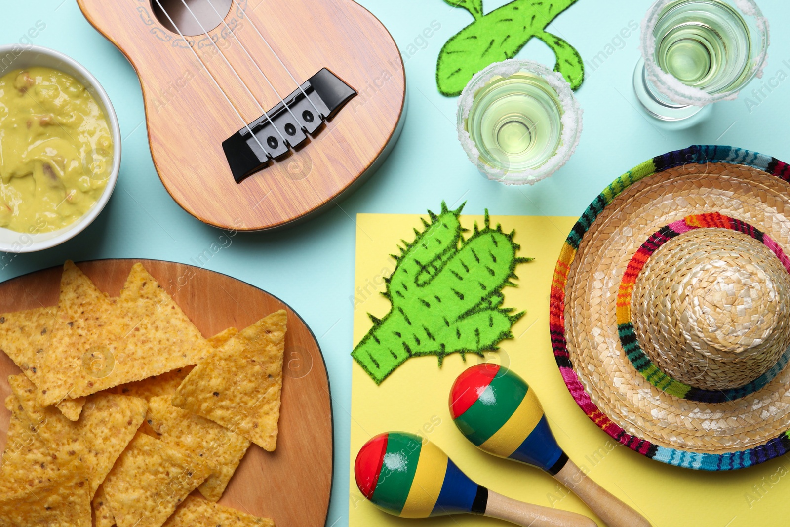 Photo of Flat lay composition with Mexican sombrero hat on color background