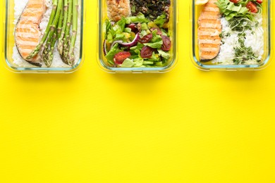 Photo of Healthy food. Different meals in glass containers on yellow background, flat lay. Space for text