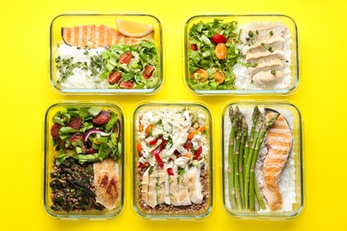 Photo of Healthy food. Different meals in glass containers on yellow background, flat lay