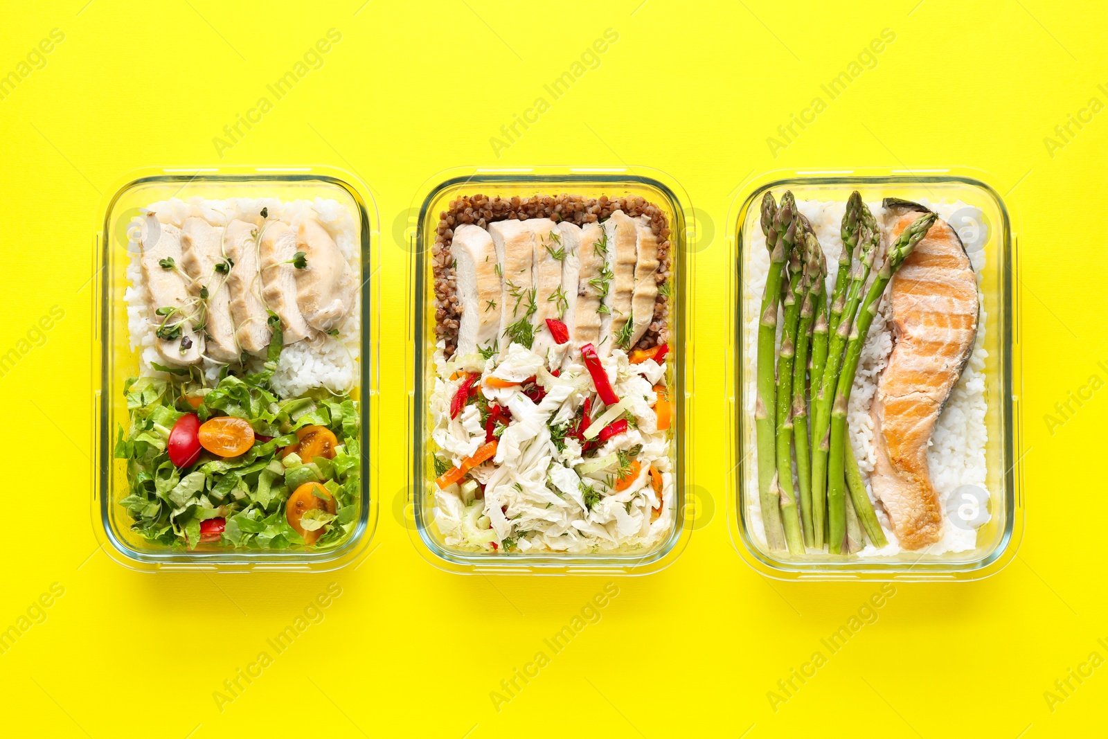 Photo of Healthy food. Different meals in glass containers on yellow background, flat lay