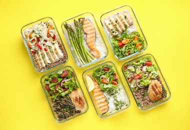 Photo of Healthy food. Different meals in glass containers on yellow background, flat lay