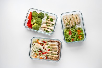 Healthy food. Different meals in glass containers on white background, flat lay